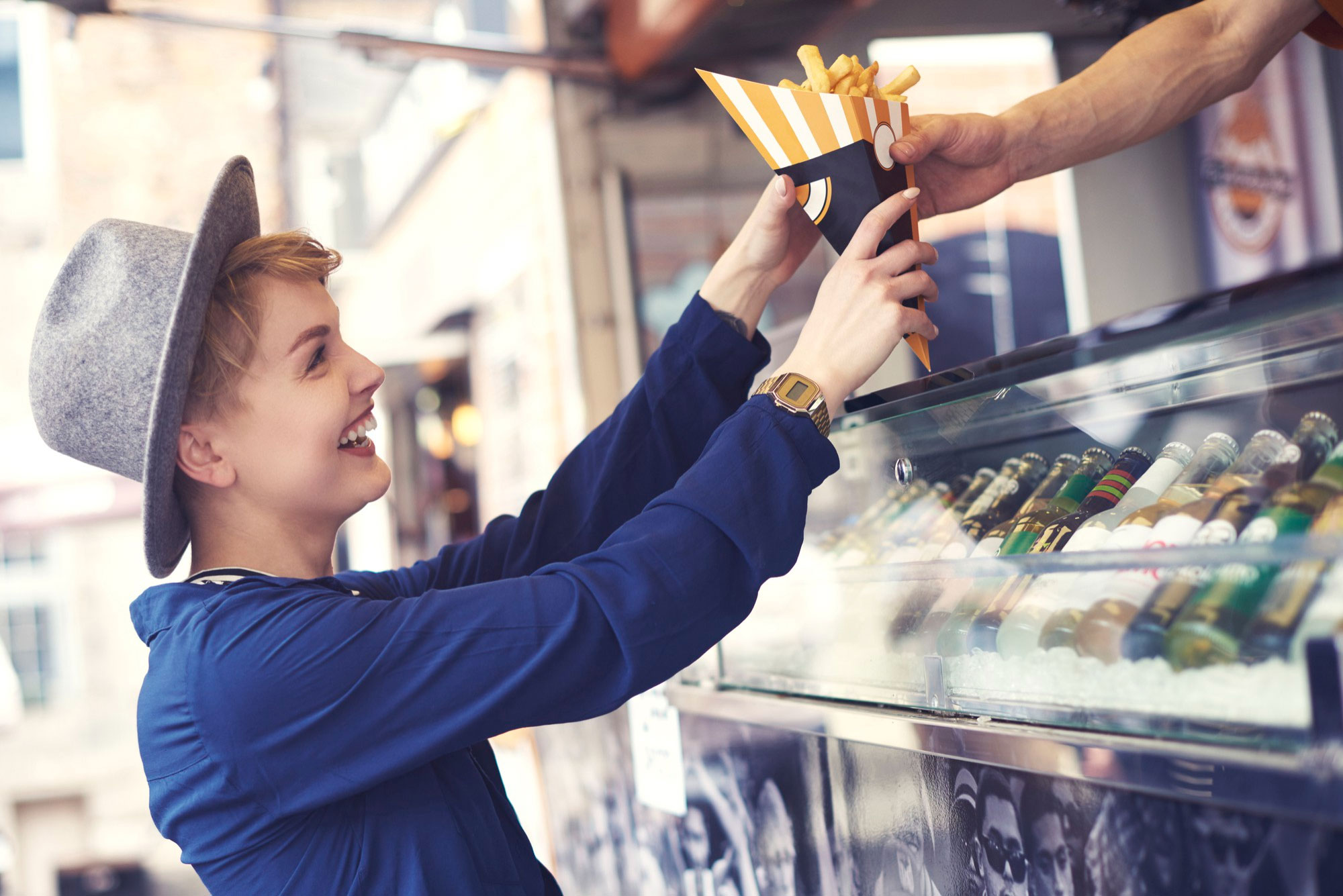 female-customer-reaching-food-from-vendor-(1)